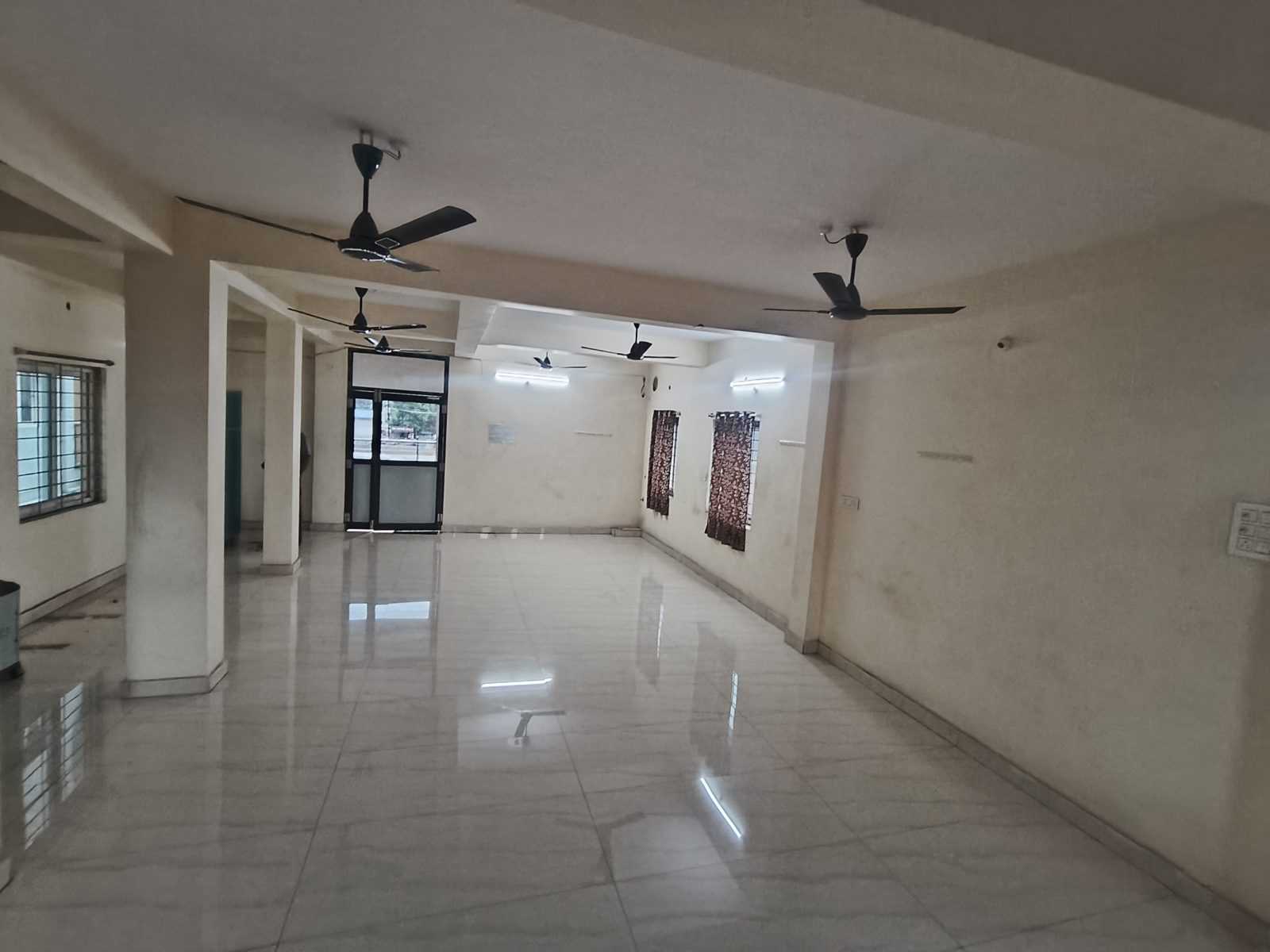 Stage-facing view of the celebration hall with pillared ceiling